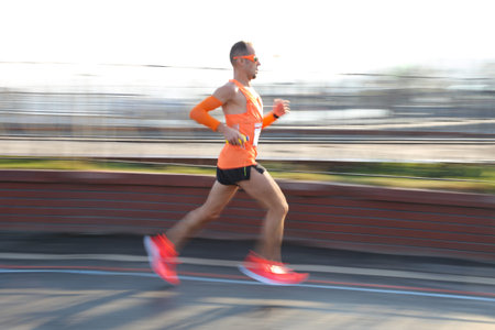 ISTANBUL, TURKEY - NOVEMBER 11, 2018: Athlete running in 40. Istanbul marathon which includes two continents in one race. Marathon starts on the Asian side and finishs in European side of Istanbul.のeditorial素材