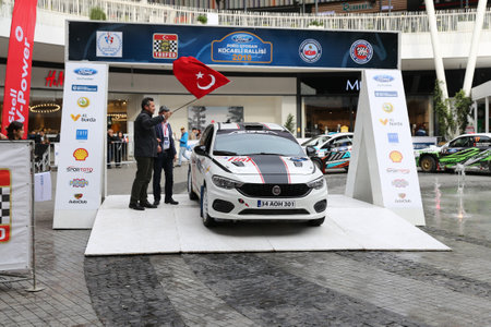 KOCAELI, TURKEY - NOVEMBER 17, 2018: Yigit Timur with Fiat Egea 1.4 T-Jet of Fiat Motorsporlari Team in ceremonial start of Kocaeli Rallyのeditorial素材