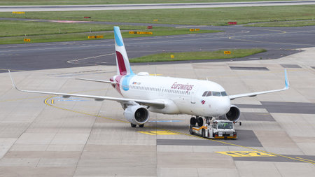 DUSSELDORF, GERMANY - MAY 26, 2019: Eurowings Airbus A320-214 (CN 7210) push back in Dusseldorf Airport.のeditorial素材
