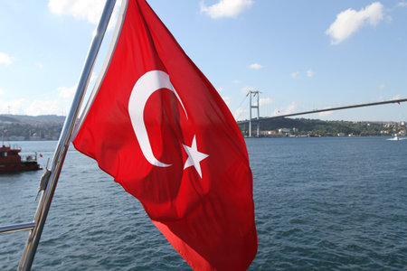 Turkish Flag and Bosphorus Strait in Istanbul City, Turkeyの写真素材