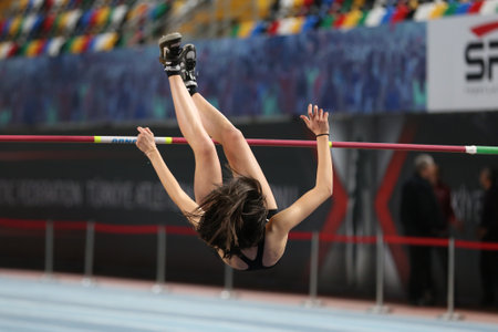 ISTANBUL, TURKEY - FEBRUARY 29, 2020: Undefined athlete high jumping during âRuhi Sarialp Jumping Events Indoor Cupのeditorial素材