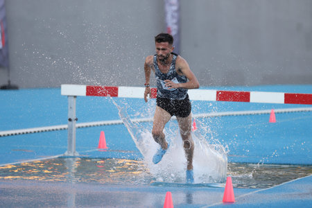 ISTANBUL, TURKEY - SEPTEMBER 05, 2020: Undefined athlete running 3000 metres steeplechase during...