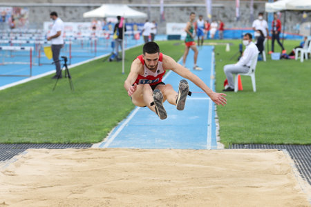 ISTANBUL, TURKEY - SEPTEMBER 13, 2020: Undefined athlete triple jumping during Balkan U20 Athletics Championshipsのeditorial素材