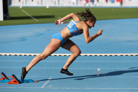 ISTANBUL, TURKEY - SEPTEMBER 12, 2020: Undefined athlete running 400 metres hurdles during Balkan U20 Athletics Championshipsのeditorial素材