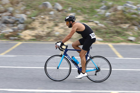 ISTANBUL, TURKEY - OCTOBER 18, 2020:  Undefined athlete competing in cycling component of Istanbul Sprint Triathlonのeditorial素材