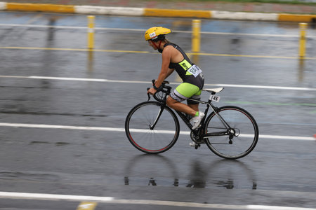 ISTANBUL, TURKEY - OCTOBER 18, 2020:  Undefined athlete competing in cycling component of Istanbul Sprint Triathlonのeditorial素材
