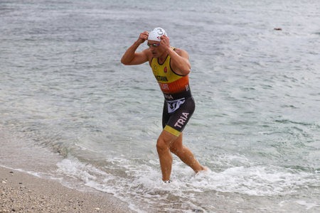 ISTANBUL, TURKEY - OCTOBER 18, 2020:  Undefined athlete competing in swimming component of Istanbul Sprint Aquathlonのeditorial素材