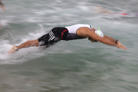 ISTANBUL, TURKEY - OCTOBER 18, 2020:  Undefined athlete competing in swimming component of Istanbul Sprint Triathlonのeditorial素材