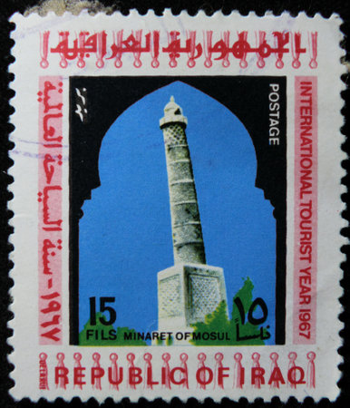 ISTANBUL, TURKEY - DECEMBER 26, 2020: Iraq stamp shows Minaret of Mosul circa 1967のeditorial素材