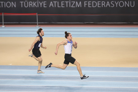ISTANBUL, TURKEY - JANUARY 26, 2021: Athletes running 60 metres during Turkish Athletic Federation Threshold Competitionsのeditorial素材