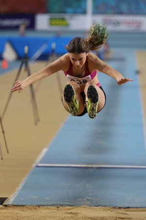 ISTANBUL, TURKEY - FEBRUARY 06, 2021: Undefined athlete long jumping during Turkish Indoor Athletics Championshipsのeditorial素材