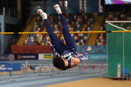 ISTANBUL, TURKEY - FEBRUARY 06, 2021: Undefined athlete high jumping during Turkish Indoor Athletics Championshipsのeditorial素材
