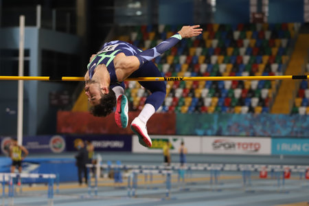 ISTANBUL, TURKEY - FEBRUARY 06, 2021: Undefined athlete high jumping during Turkish Indoor Athletics Championshipsのeditorial素材
