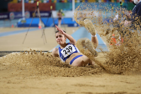 ISTANBUL, TURKEY - FEBRUARY 06, 2021: Undefined athlete long jumping during Turkish Indoor Athletics Championshipsのeditorial素材