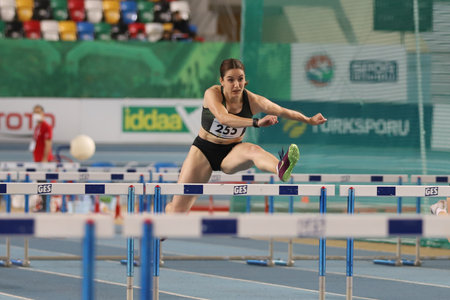 ISTANBUL, TURKEY - FEBRUARY 06, 2021: Undefined athlete running 60 metres hurdles during Turkish Indoor Athletics Championshipsのeditorial素材