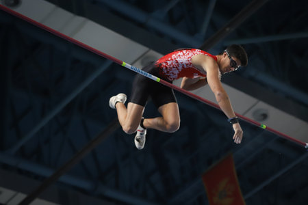 ISTANBUL, TURKEY - FEBRUARY 20, 2021: Undefined athlete pole vaulting during Balkan Athletics Indoor Championshipsのeditorial素材
