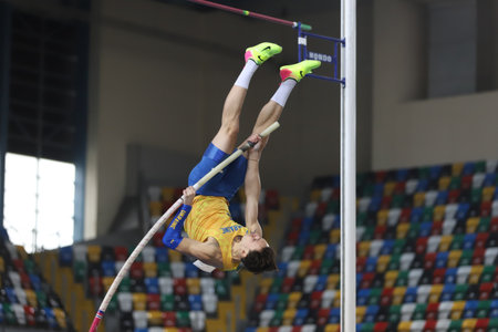 ISTANBUL, TURKEY - FEBRUARY 20, 2021: Undefined athlete pole vaulting during Balkan Athletics Indoor Championshipsのeditorial素材
