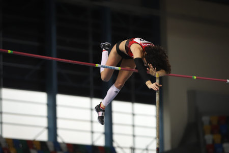 ISTANBUL, TURKEY - FEBRUARY 20, 2021: Undefined athlete pole vaulting during Balkan Athletics Indoor...