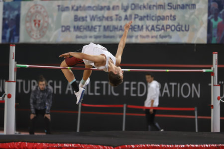 ISTANBUL, TURKEY - JANUARY 30, 2021: Undefined athlete high jumping during Turkish Athletic...