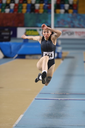 ISTANBUL, TURKEY - JANUARY 30, 2021: Undefined athlete triple jumping during Turkish Athletic Federation Olympic Threshold Competitionsのeditorial素材