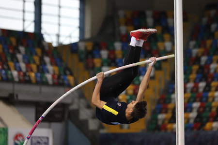 ISTANBUL, TURKEY - JANUARY 31, 2021: Undefined athlete pole vaulting during Turkish Athletic Federation Olympic Threshold Competitionsのeditorial素材