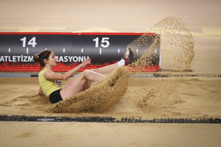 ISTANBUL, TURKEY - FEBRUARY 23, 2021: Undefined athlete triple jumping during Ruhi Sarialp Jumping...