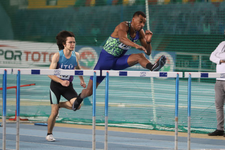 ISTANBUL, TURKEY - FEBRUARY 14, 2021: Athletes running 60 meters hurdles during Turkish Athletic Federation Threshold Competitionsのeditorial素材