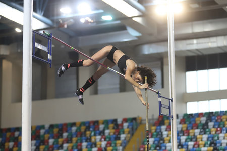 ISTANBUL, TURKEY - FEBRUARY 27, 2021: Undefined athlete pole vaulting during Turkish Athletic...