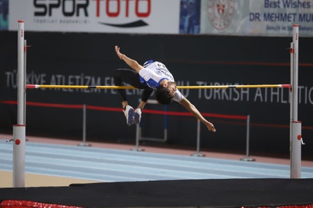 ISTANBUL, TURKEY - MARCH 14, 2021: Undefined athlete high jumping during Turkish Athletic Federation Municipalities Indoor Athletics Championshipsのeditorial素材