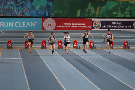 ISTANBUL, TURKEY - MARCH 14, 2021: Athletes running 60 metres during Turkish Athletic Federation Municipalities Indoor Athletics Championshipsのeditorial素材