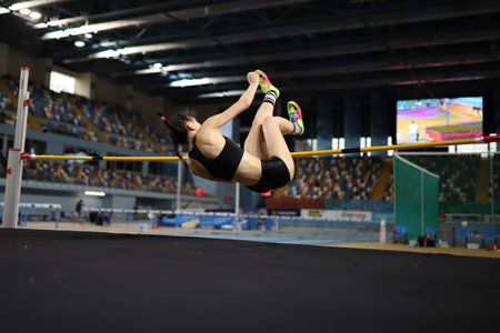 ISTANBUL, TURKEY - MARCH 07, 2021: Undefined athlete high jumping during Turkish Athletic Federation Combined Track and Field Competitions Championshipsのeditorial素材