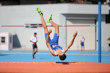 ISTANBUL, TURKEY - JUNE 12, 2021: Undefined athlete high jumping during Balkan U20 Athletics Championshipsのeditorial素材