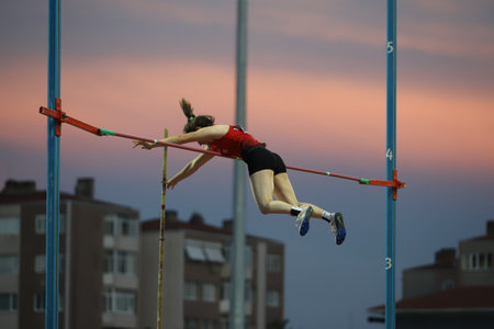 ISTANBUL, TURKEY - JUNE 12, 2021: Undefined athlete pole vaulting during Balkan U20 Athletics Championshipsのeditorial素材