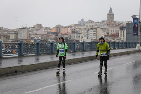 ISTANBUL, TURKEY - APRIL 04, 2021: Skater running Istanbul Half Marathon in Galata Bridge