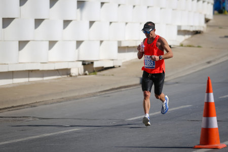 IZMIR, TURKEY - APRIL 11, 2021: Athlete running Marathon Izmirのeditorial素材