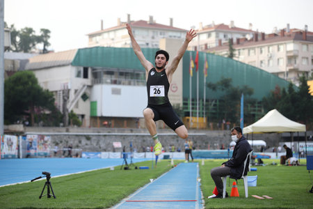 ISTANBUL, TURKEY - JUNE 23, 2021: Undefined athlete long jumping during Turkish Athletic Federation Cezmi Or Cupのeditorial素材