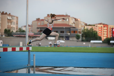 ISTANBUL, TURKEY - JUNE 23, 2021: Undefined athlete running 3000 metres steeplechase during Turkish...