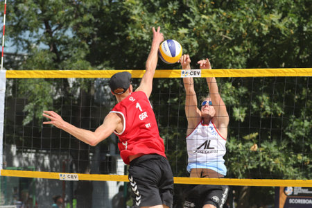 IZMIR, TURKEY - JULY 09, 2021: Germany (Just and Wust) vs Slovakia (Brilla J. and Brilla L.) pool match of CEV U20 Beach Volleyball European Championships in Inciralti Beach.のeditorial素材