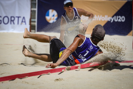 IZMIR, TURKEY - JULY 10, 2021: Ukraine (Boiko and Bublyk) vs Slovakia (Brilla J. and Brilla L.) Round of 24 match of CEV U20 Beach Volleyball European Championships in Inciralti Beach.のeditorial素材