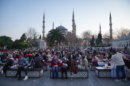 ISTANBUL, TURKEY - APRIL 09, 2022: People are waiting to breaking the fast in Sultanahmet Square during ramadan.のeditorial素材