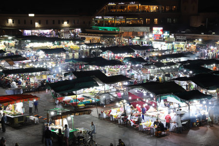 MARRAKESH, MOROCCO - OCTOBER 29, 2021: People in Jemaa el-Fnaa where main square of Marrakesh, used...