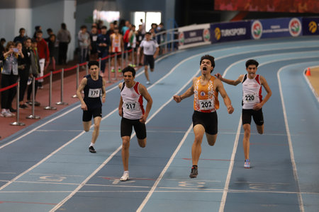 ISTANBUL, TURKEY - DECEMBER 11, 2021: Athletes running during Turkish Athletic Federation Olympic Threshold Competitionsのeditorial素材