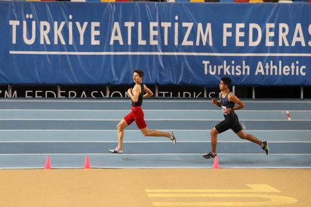 ISTANBUL, TURKEY - DECEMBER 11, 2021: Athletes running during Turkish Athletic Federation Olympic Threshold Competitionsのeditorial素材