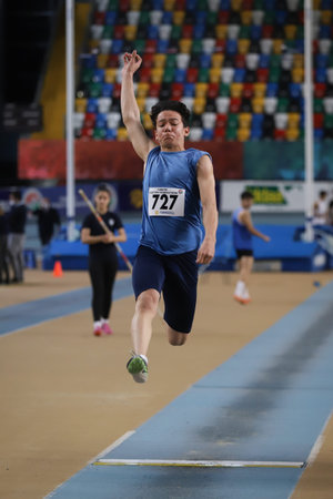 ISTANBUL, TURKEY - FEBRUARY 19, 2022: Undefined athlete triple jumping during Turkey Olympic...