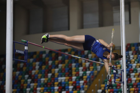 ISTANBUL, TURKEY - FEBRUARY 19, 2022: Undefined athlete pole vaulting during Turkey Olympic Preparation Center Athletes Indoor Festival in Atakoy Athletics Arenaのeditorial素材