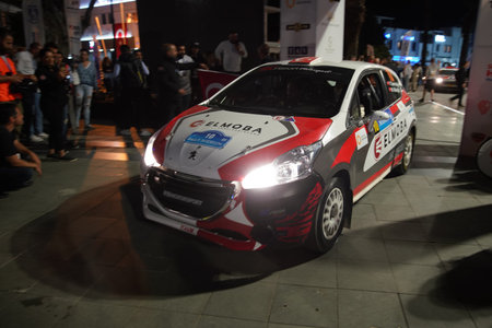 MUGLA, TURKEY - APRIL 15, 2022: Yildiray Demircioglu with Peugeot 208 R2 of Bc Vision Motorsport in ceremonical start of Bodrum Rallyのeditorial素材