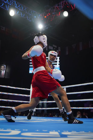 ISTANBUL, TURKEY - MAY 19, 2022: Jitpong Jutamas (Red) and Nikhat Zareen (Blue) compete during IBA Womens World Boxing Championshipsのeditorial素材