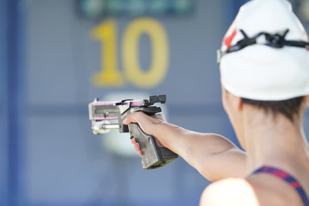ISTANBUL, TURKIYE - JULY 02, 2022: Undefined athlete competing in laser pistol shooting component of modern pentathlon during Maltepe Water Sports Festivalのeditorial素材