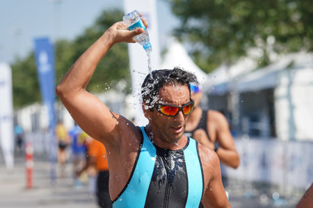 ISTANBUL, TURKIYE - JULY 02, 2022: Undefined athlete competing in running component of aquathlon during Maltepe Water Sports Festivalのeditorial素材