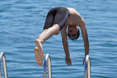 ISTANBUL, TURKIYE - JULY 03, 2022: Undefined athlete competing in swimming component of modern pentathlon during Maltepe Water Sports Festivalのeditorial素材